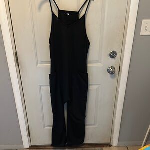 Black Fitted Jumpsuit with Spaghetti Straps and High Neckline